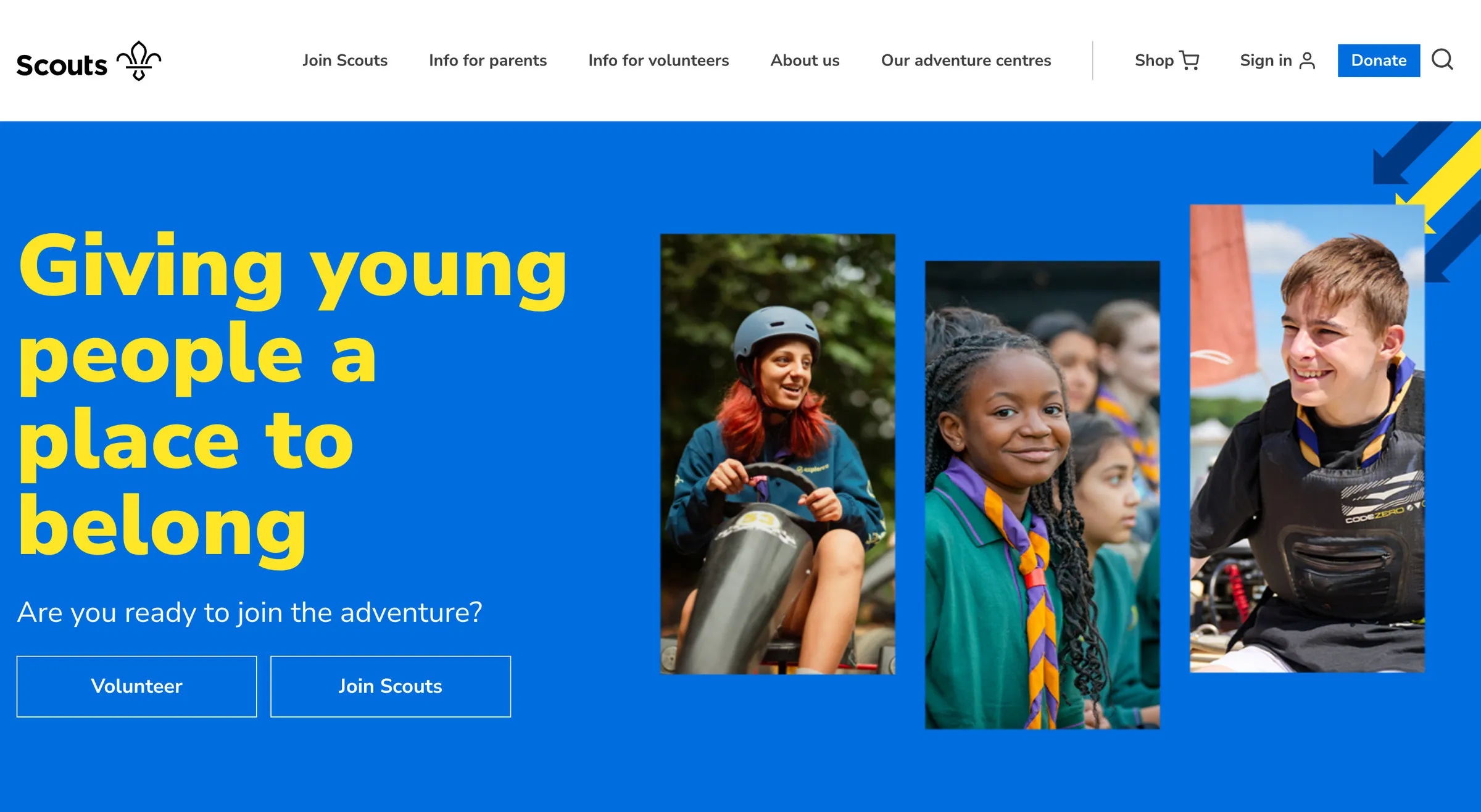 Scouts’ homepage: the headline Giving young people a place to belong in yellow on bright blue, with photos of young people cut into angled shapes, the buttons Volunteer and Join Scouts, and a strip reading Explore our age groups