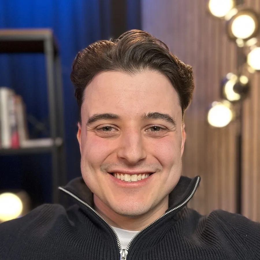 Nick Croce, founder of Design by Ency, smiling in a studio