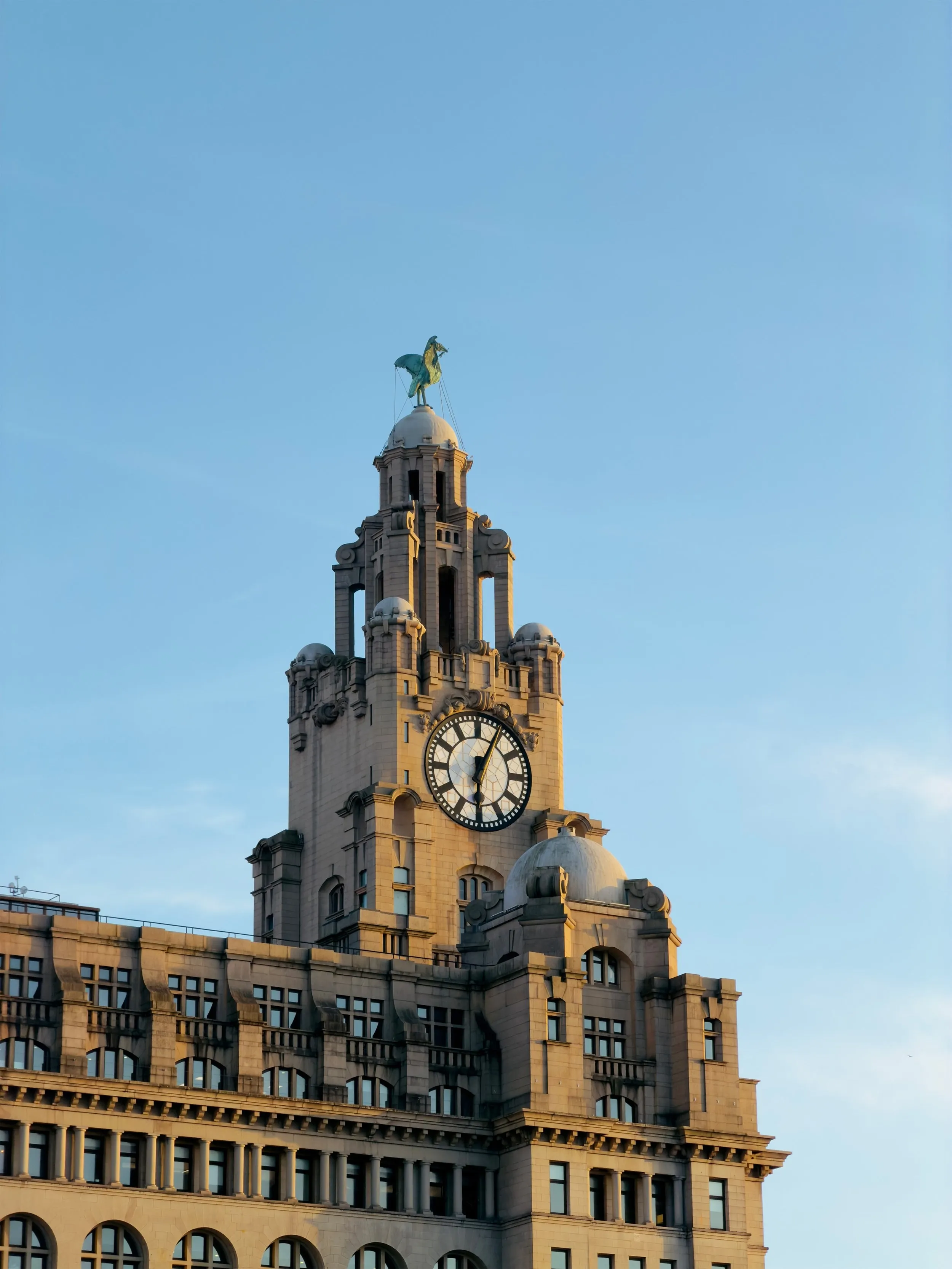 The Royal Liver Building clock tower and Liver Bird in evening light, photographed by Nick Croce